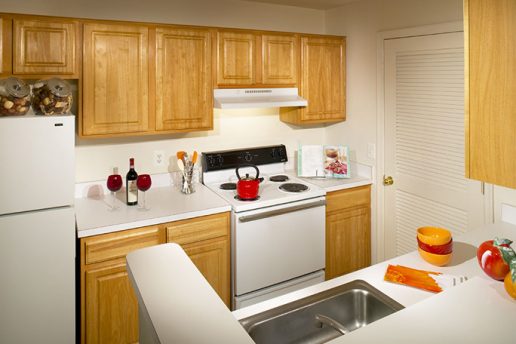 Kitchen with oven, sink and cabinets